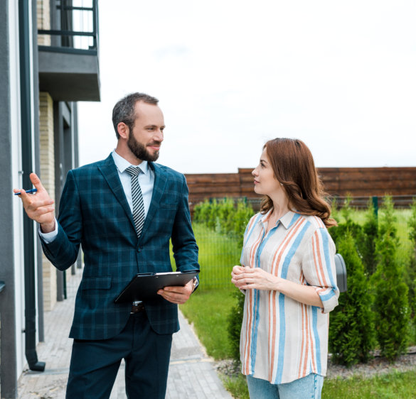 Real Estate Agent Discussing Property Sale with Woman