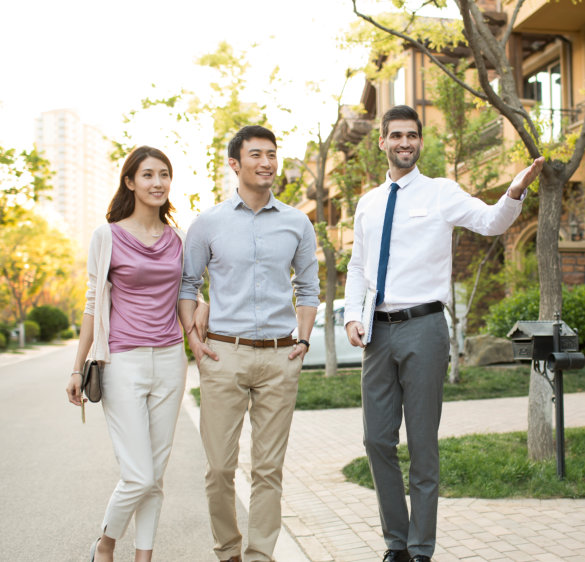 Couple Touring Property with Real Estate Agent
