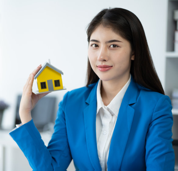 Real estate house agent showing house model