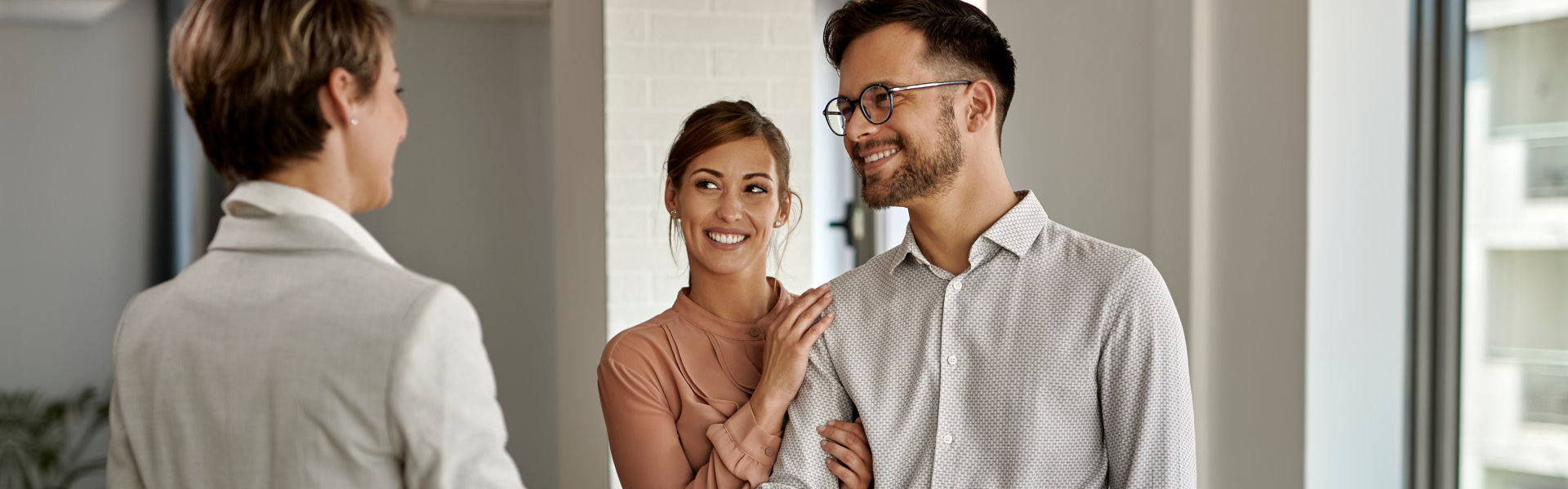 realtor and couple having a conversation