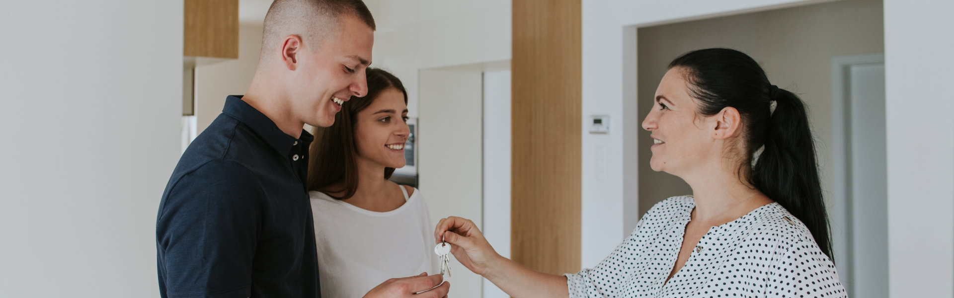 couple smiling at the realtor